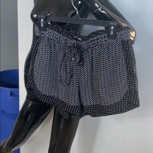 Jennifer lopez shorts with gold tassels